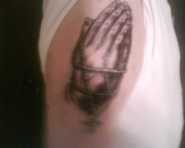 praying hands rosary tattoo. Praying hands with rosary.
